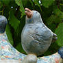 Décoration céramique : Personnage bouffon et oiseau